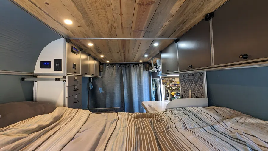 Finished camper interior with cedar ceiling and custom cabinetry — Big Bear Camper Vans build