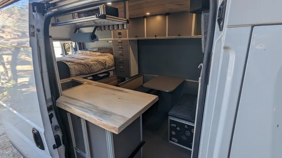 Butcher block prep counter and dinette from the slider — Big Bear Camper Vans build